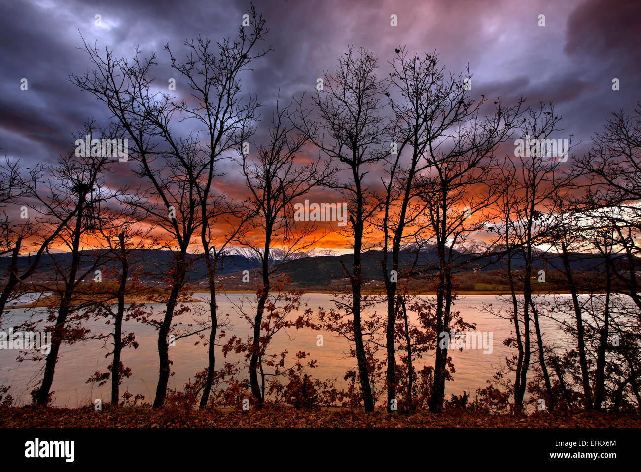 Sunset at Plastiras lake, Karditsa, Thessaly, Greece. In the background, Agrafa mountains Stock Photo