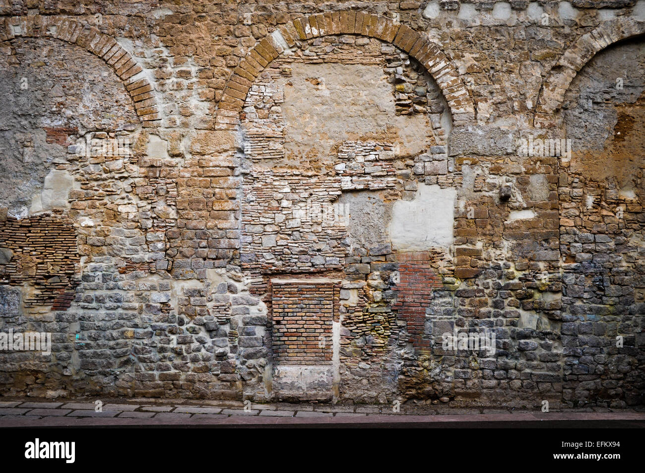 old Roman Wall with many repairs updates in Barcelona Spain Stock Photo