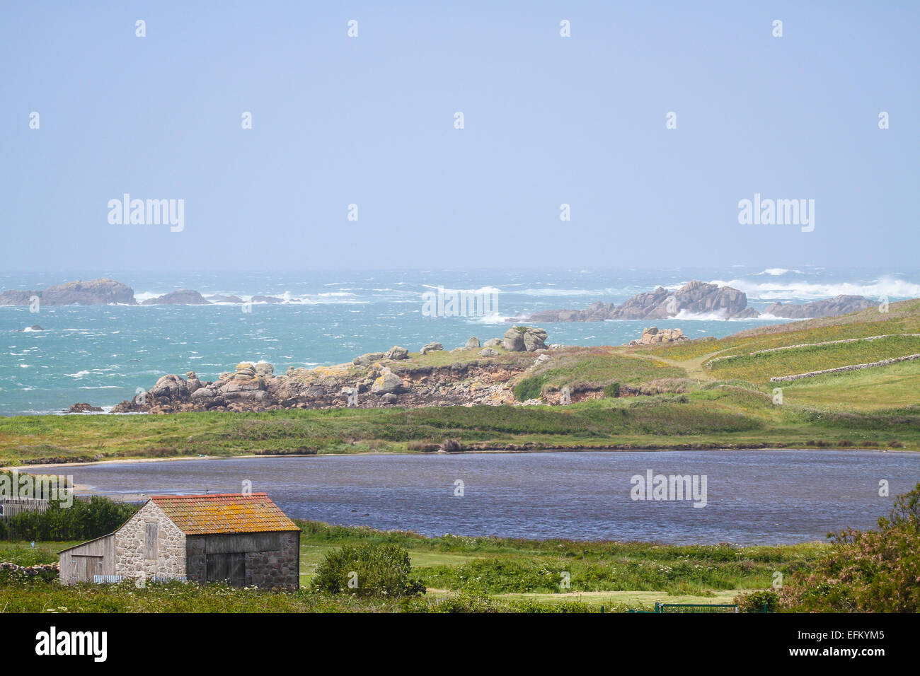 Stormy ocean waves on rocky coastline, Isles of Scilly, Cornwall, UK Stock Photo