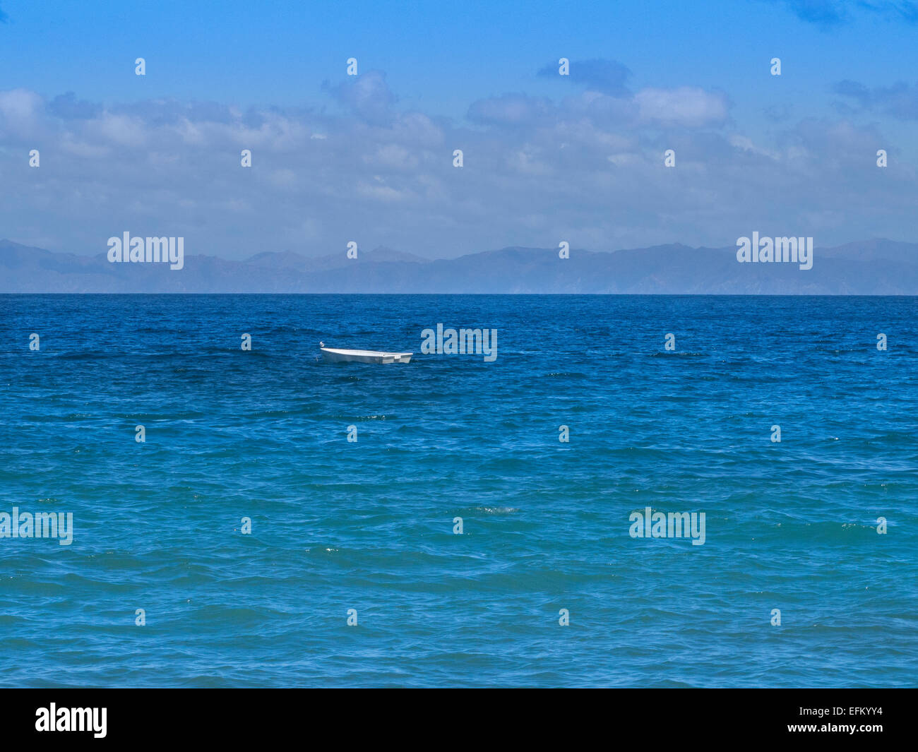 one small boat on ocean Stock Photo - Alamy