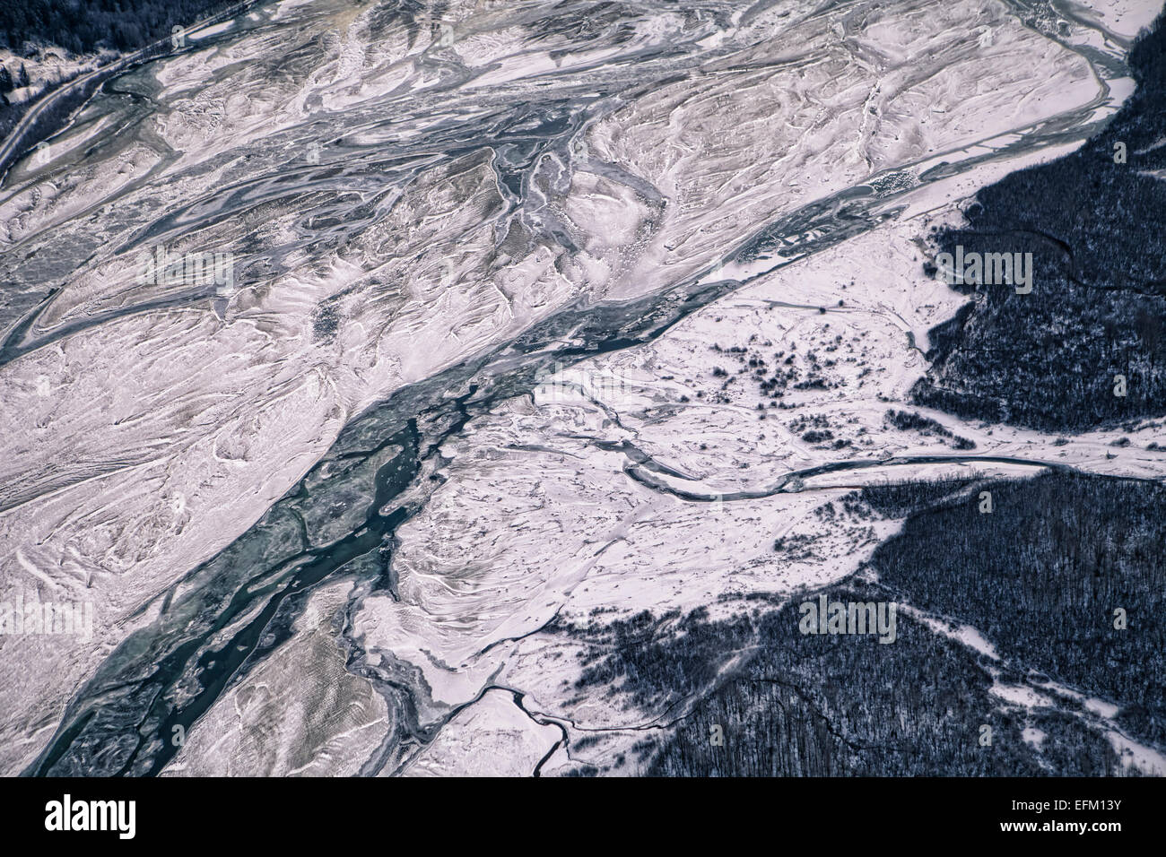 Ice and snow in winter on the Chilkat River near Haines Alaska as seen from the air. Stock Photo