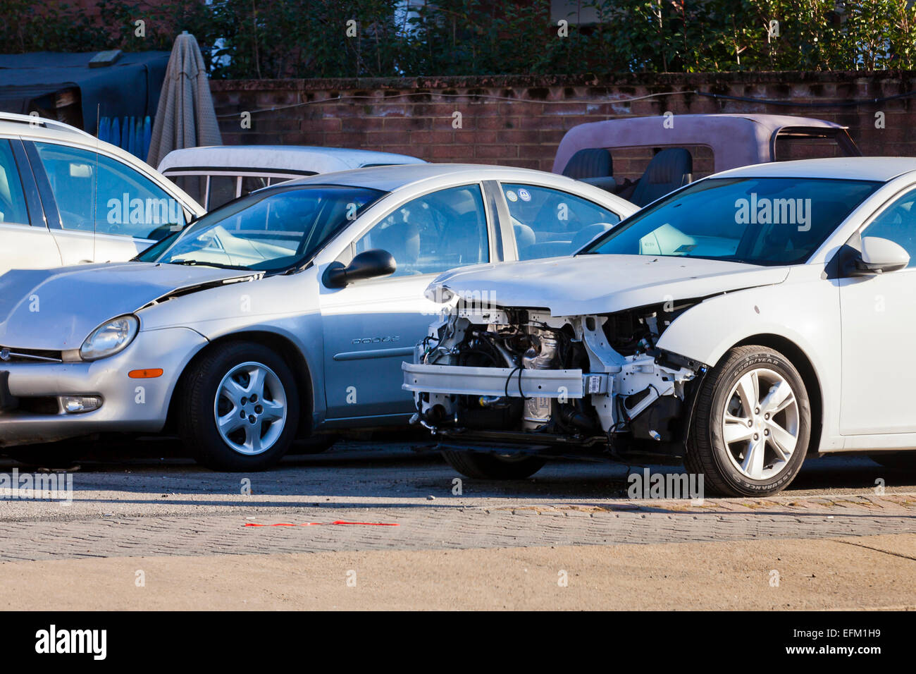 Car with front end collision damage at auto body repair shop - USA Stock Photo