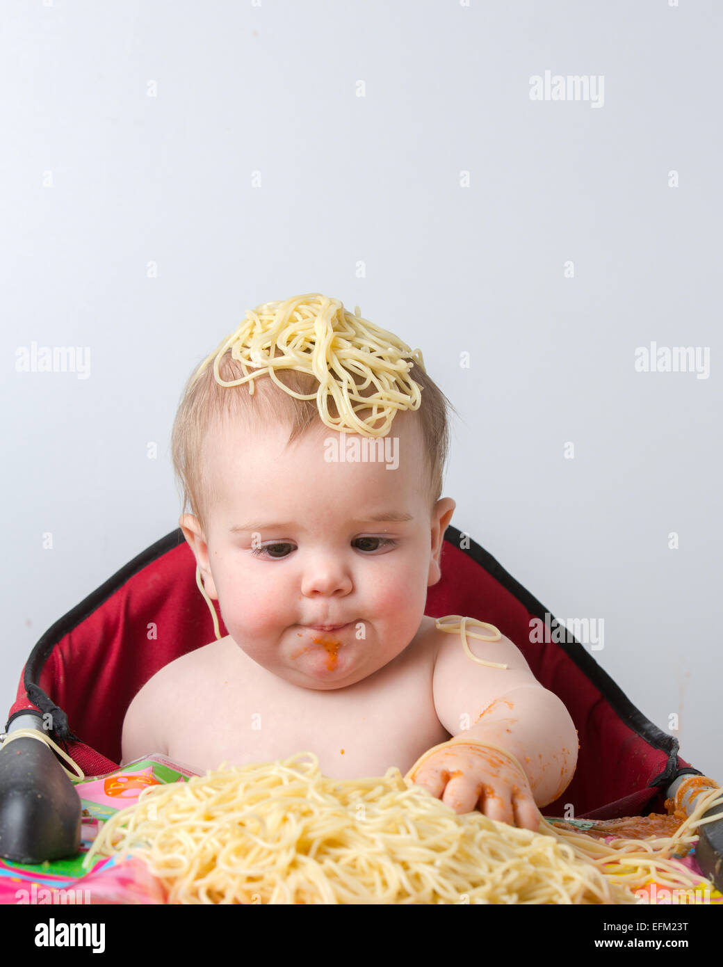 12 month old baby eating pasta Stock Photo Alamy