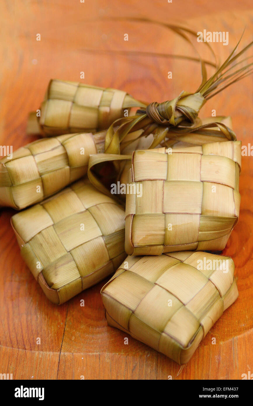 Ketupat, compressed Rice cake cooked in woven coconut leaf Stock Photo
