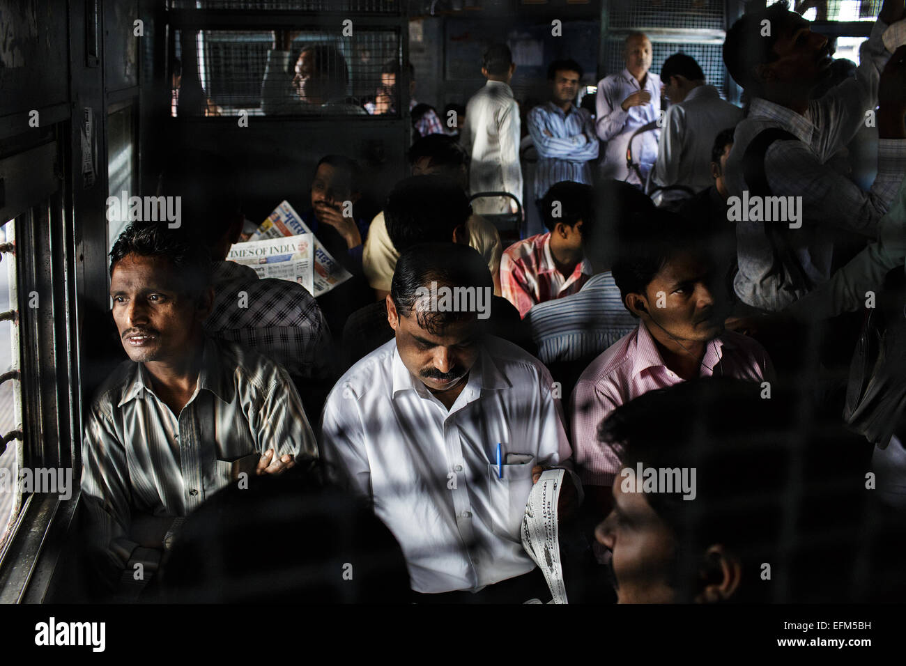 Commuters on a suburban train in Mumbai, India Stock Photo