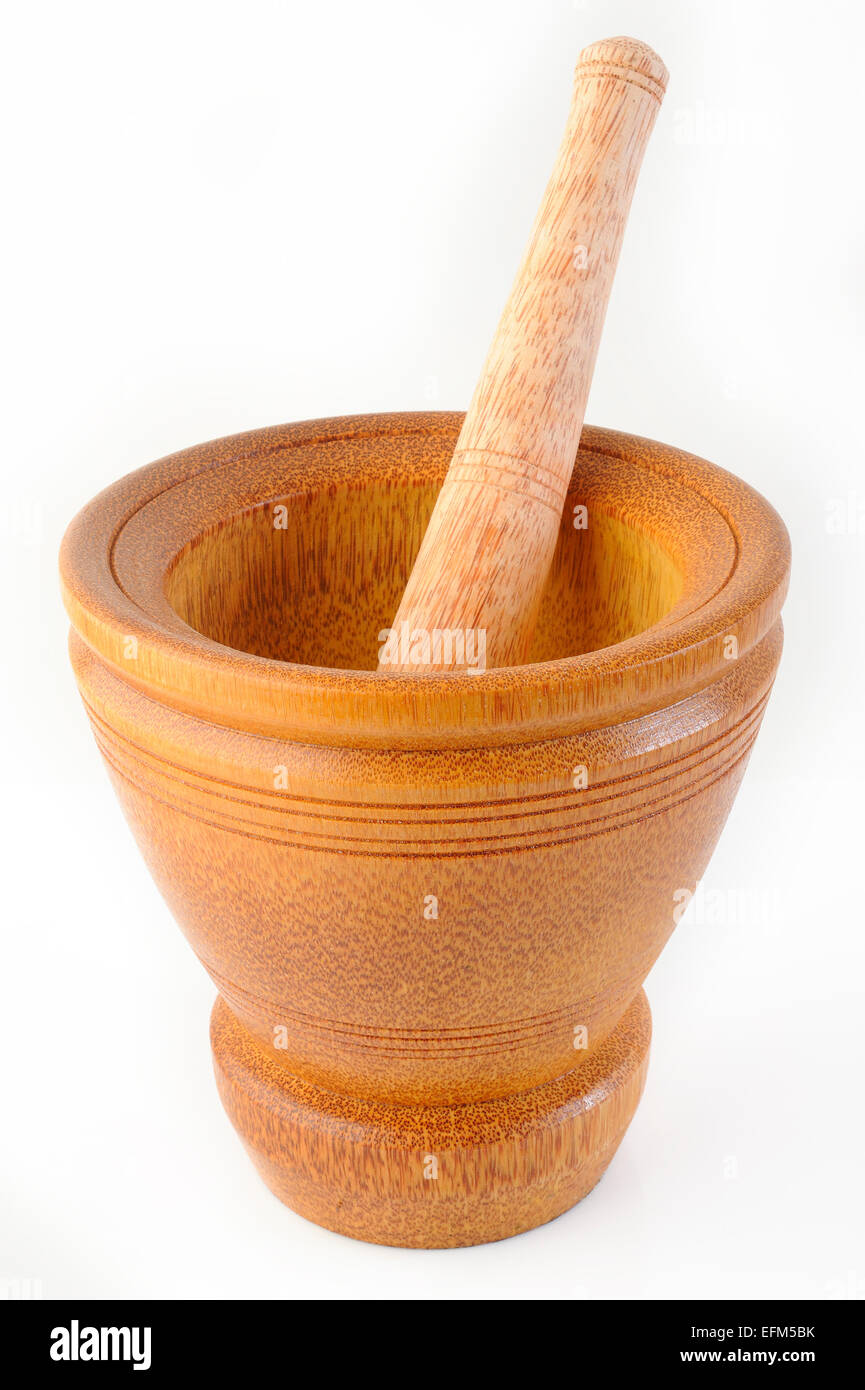 Wooden mortar and pestle on white background Stock Photo