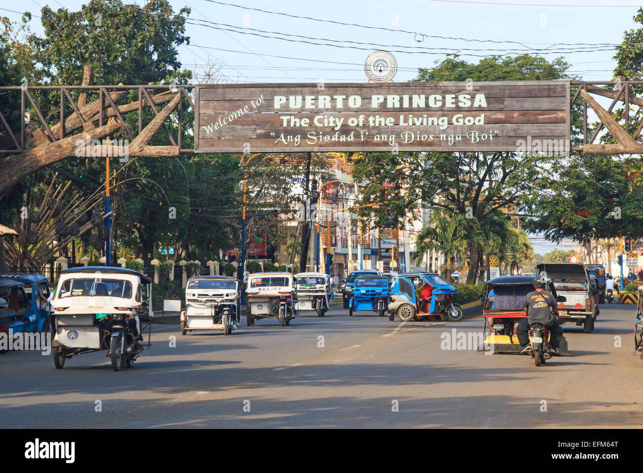 Puerto Princesa, January 20, 2015: Street crowded with many tricycles, very common in the Philippines Stock Photo