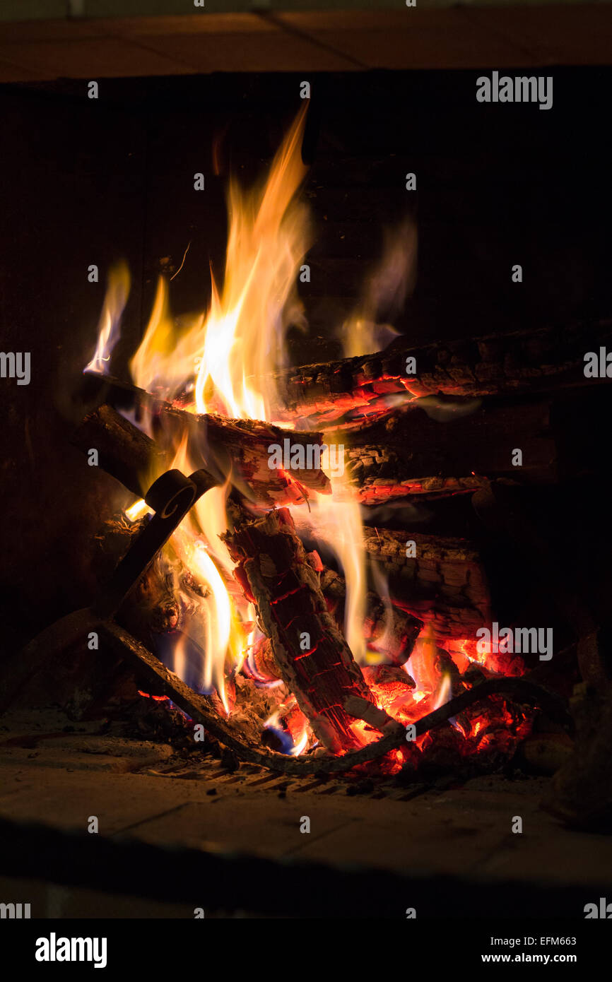 fire flame fireplace woods burn smoldering texture indoors Stock Photo