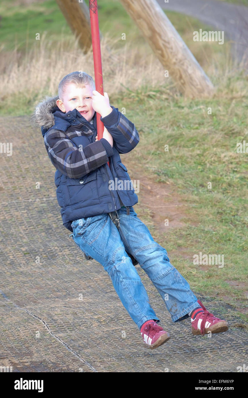 Boy on zip-wire ride at Brockholes Nature Reserve Preston, Lancashire Stock Photo