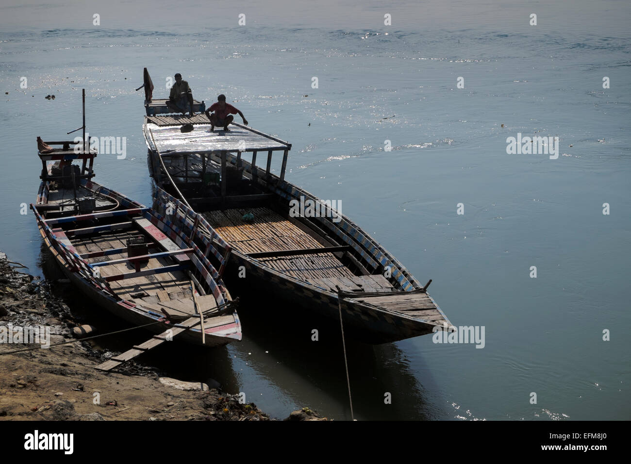 Two traditional wooden boats used as passenger ferries Brahmaputra river Assam North East India Stock Photo