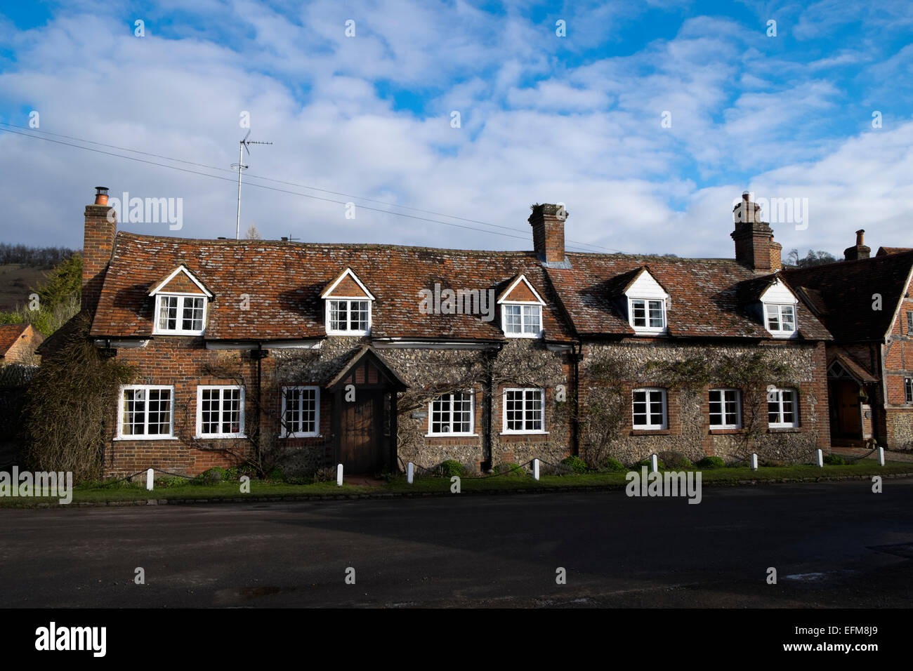 Traditional brick and flint cottage Turville village Buckinghamshire UK Stock Photo