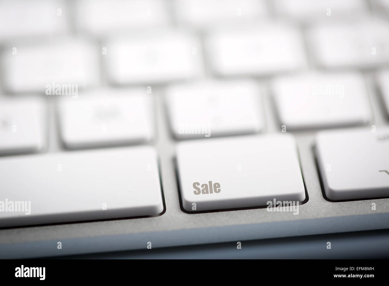 The word 'SALE' written on metallic keyboard Stock Photo