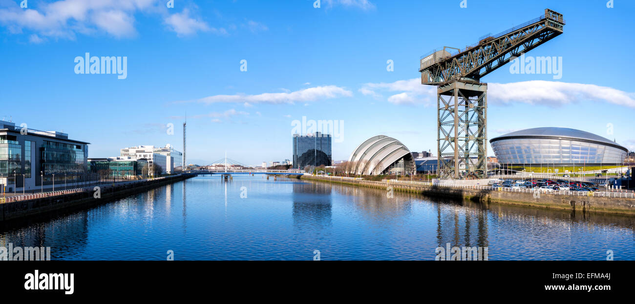 Panoramic of the River Clyde in Glasgow, looking west to the SECC (Armadillo), the SSE Hydro, the Finnieston Crane, the Bells, B Stock Photo