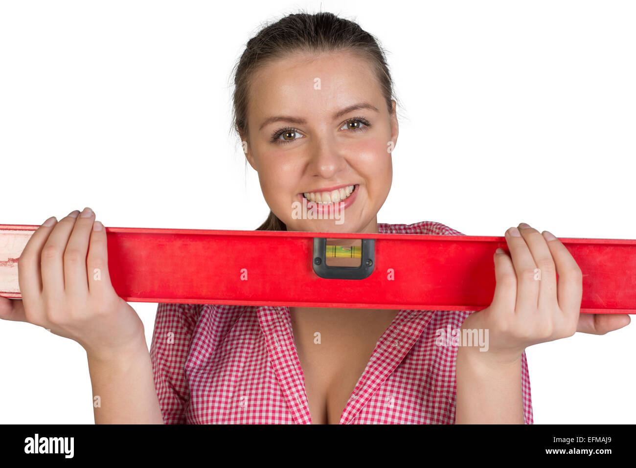Woman holding builders level Stock Photo