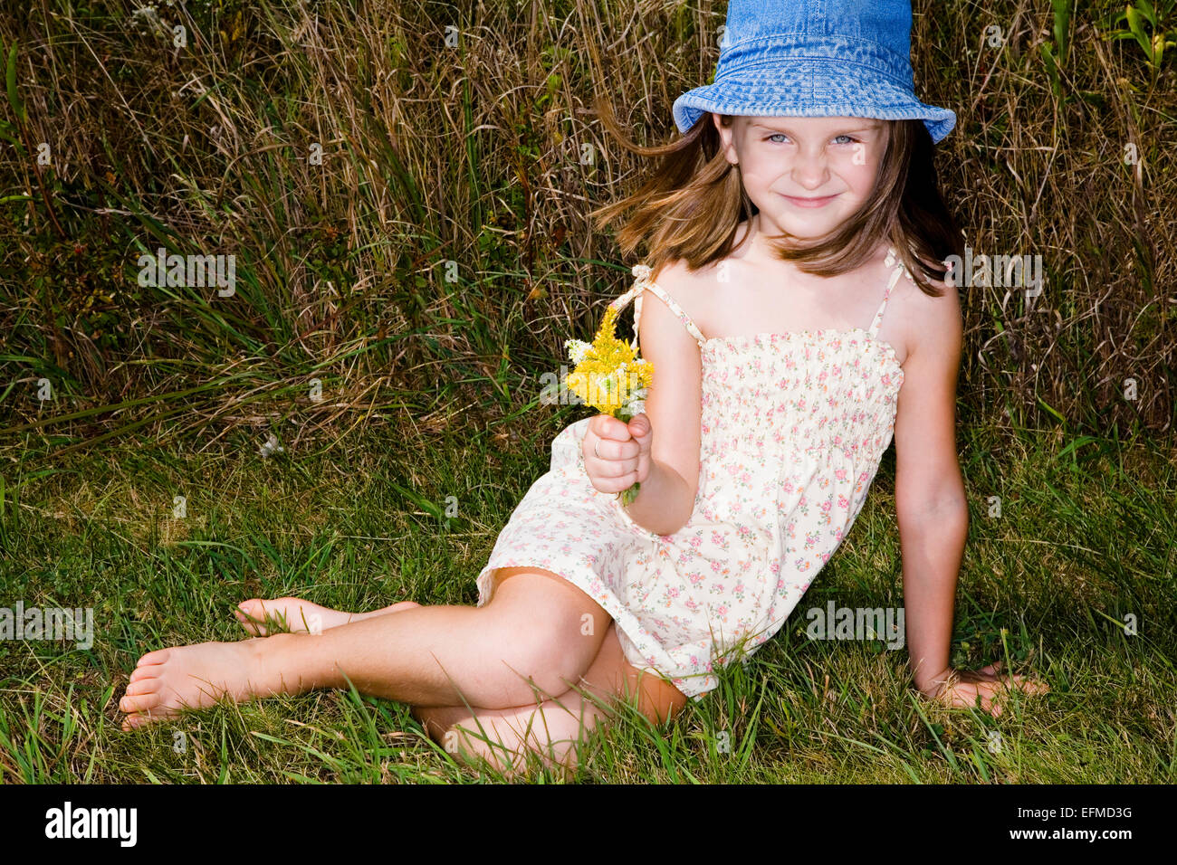 Little girl in short dress enjoys warm fall day Stock Photo Alamy