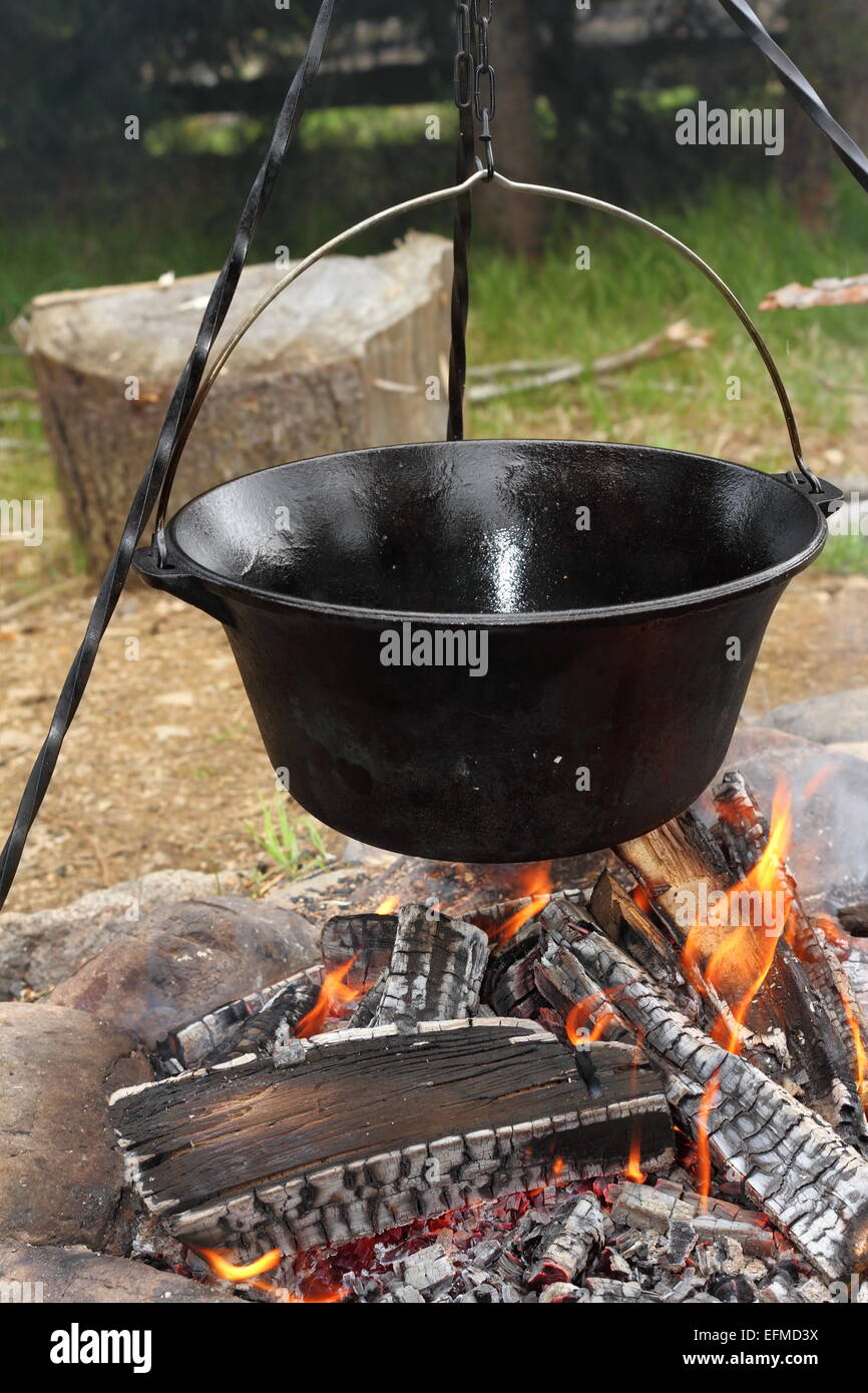 https://c8.alamy.com/comp/EFMD3X/healthy-cooking-on-ancient-traditional-big-metal-pot-vintage-black-EFMD3X.jpg