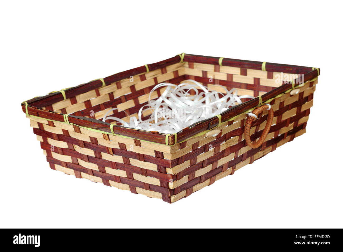 isolated wattle basket full of white plastic ribands Stock Photo