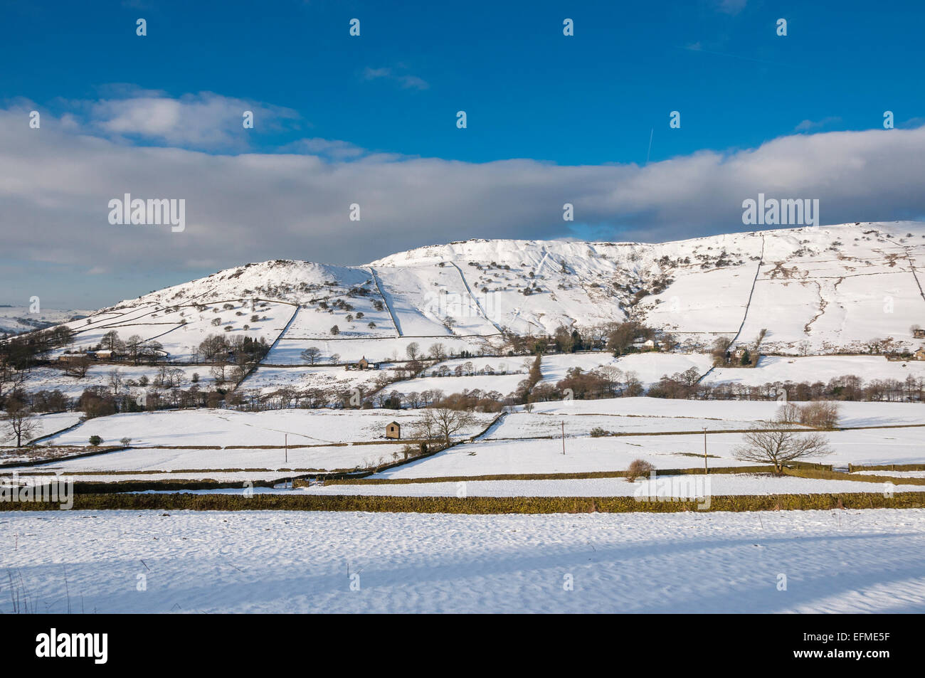 Cracken edge near Chinley in Derbyshire on a bright and sunny winters day. A snowy winter landscape. Stock Photo