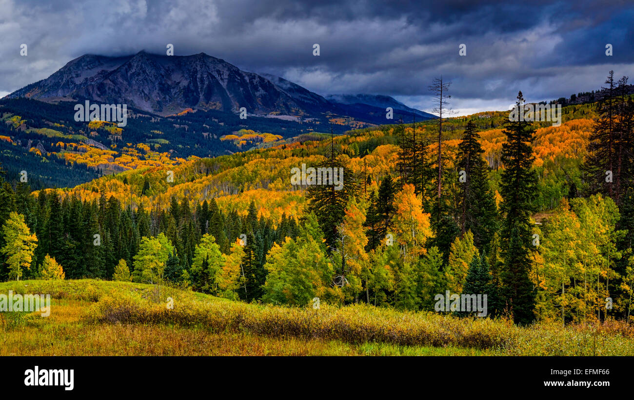 East Beckwith Mountains stands shrouded in clouds before sunset along
