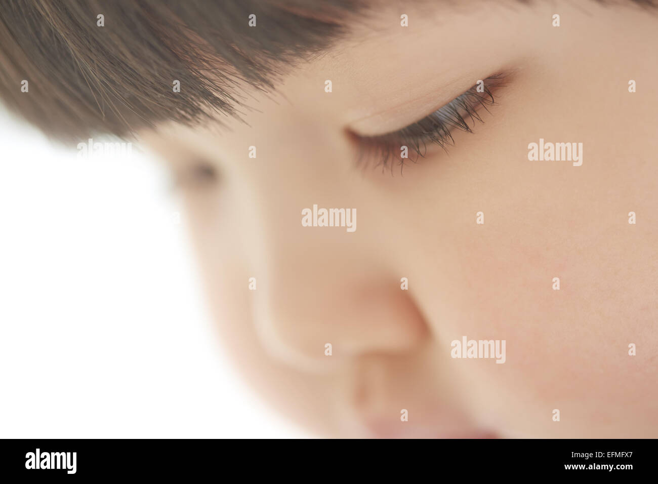 Close-up photo of pensive child looking down Stock Photo