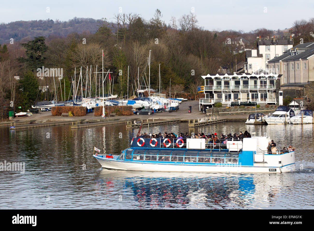 Lake Windermere Cumbria UK 7th  February  2015  Bright sunny cold day on  Lake Windermere . Bowness Bay with the Royal Windermere Yacht Club in the background .Passenger Cruises have busy day boats full inside and on top despite the cold , Credit:  Gordon Shoosmith/Alamy Live News Stock Photo