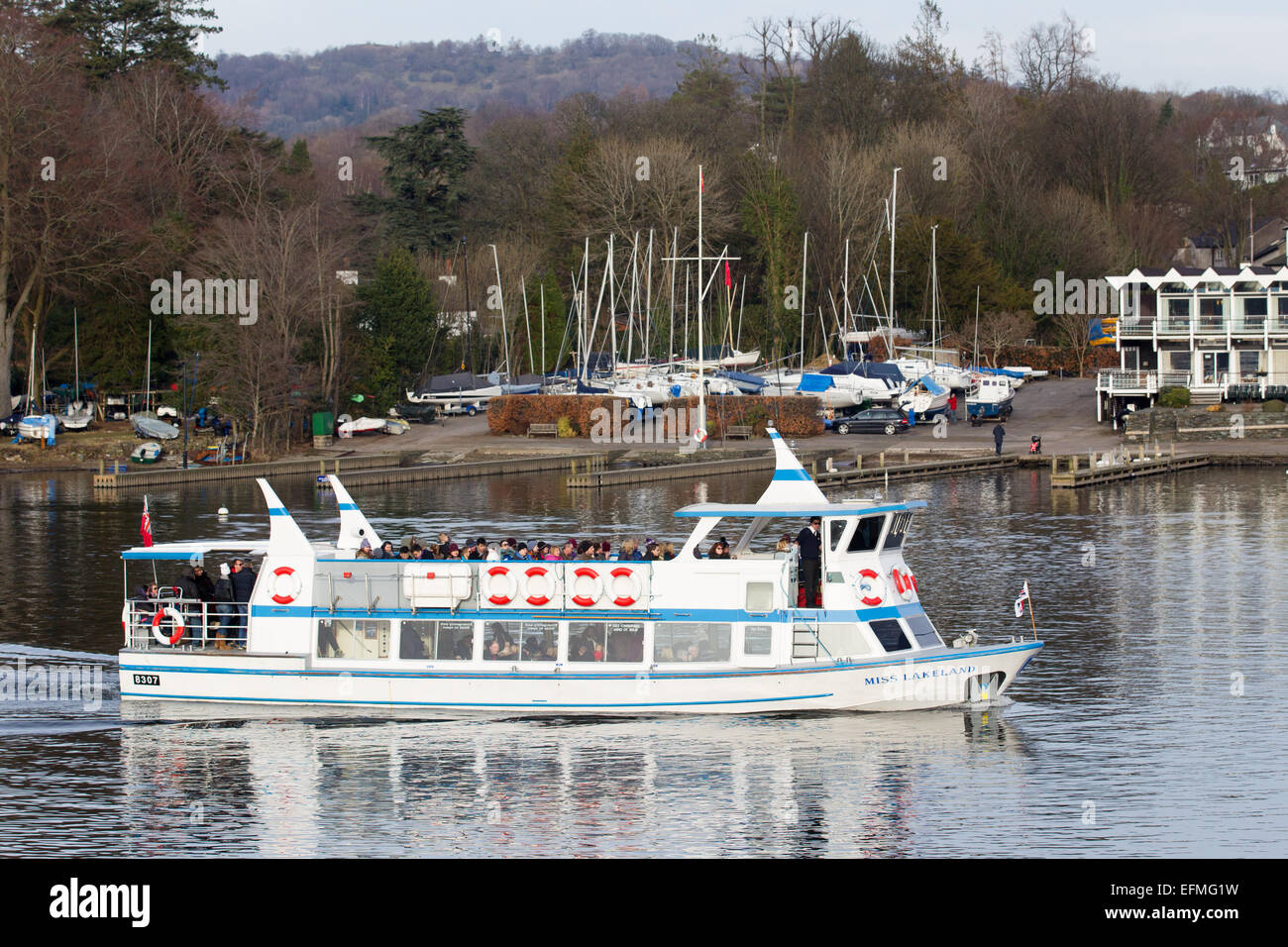 Lake Windermere Cumbria UK 7th  February  2015  Bright sunny cold day on  Lake Windermere . Bowness Bay with the Royal Windermere Yacht Club in the background .Passenger Cruises have busy day boats full inside and on top despite the cold , Credit:  Gordon Shoosmith/Alamy Live News Stock Photo
