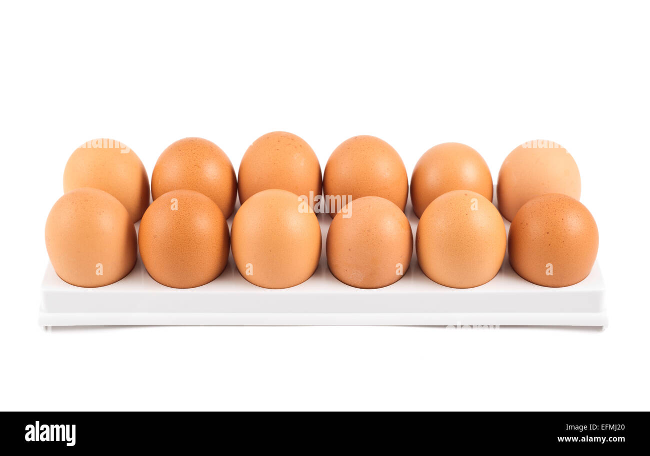 Dozen of eggs in a case isolated Stock Photo Alamy