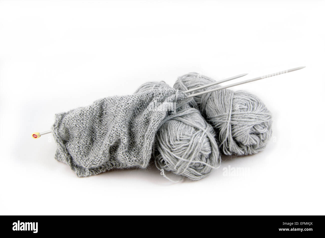 Knitting tools and two balls of yarn isolated on white Stock Photo Alamy