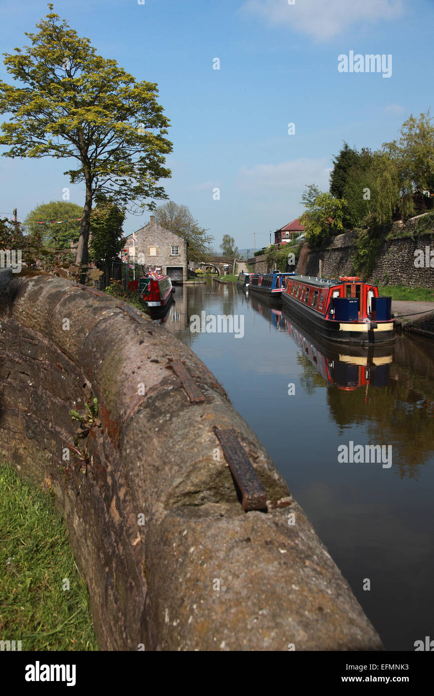Narrowboats moored on the Macclesfield Canal just before Marple Junction where it joins the Peak Forest Canal Stock Photo