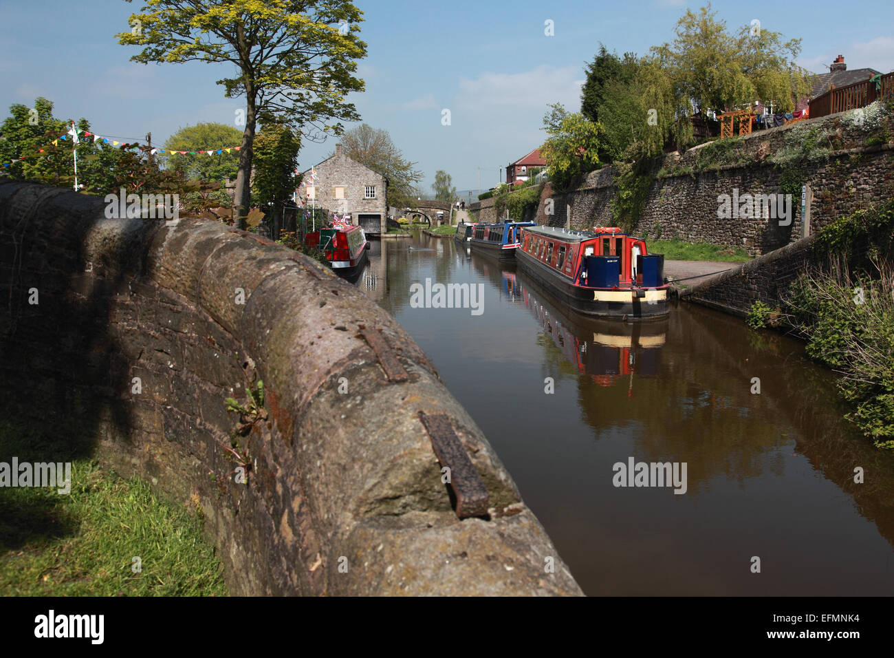 Narrowboats moored on the Macclesfield Canal just before Marple Junction where it joins the Peak Forest Canal Stock Photo