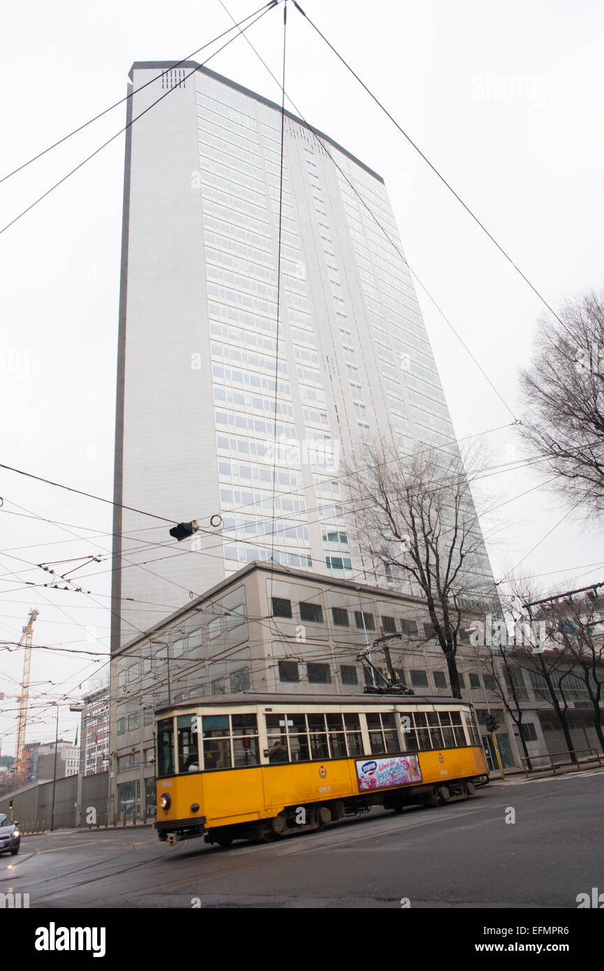 An old tram infront of the Pirelli sky scraper in Milan Stock Photo