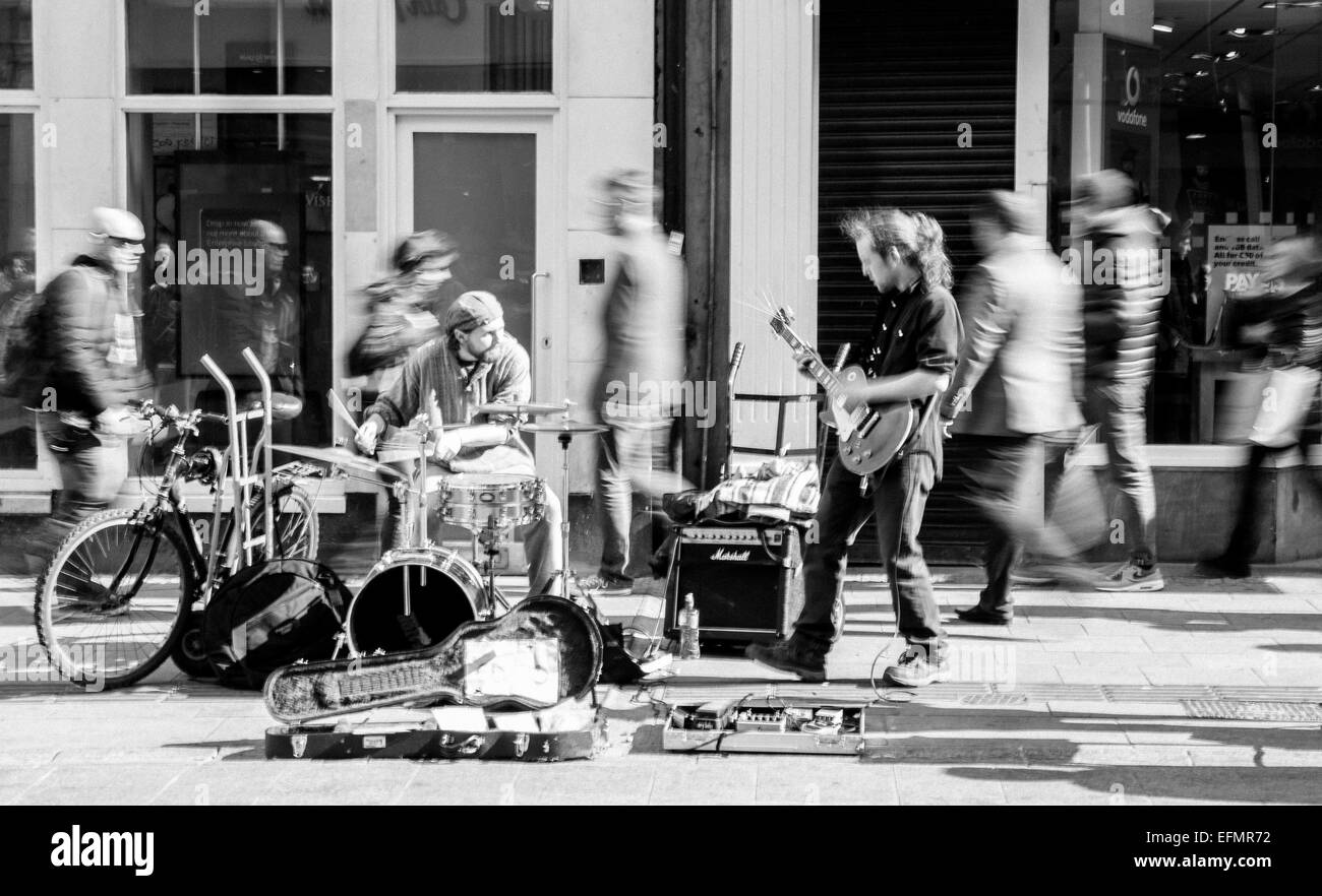 Band playing music on Dublin's Grafton Street Stock Photo