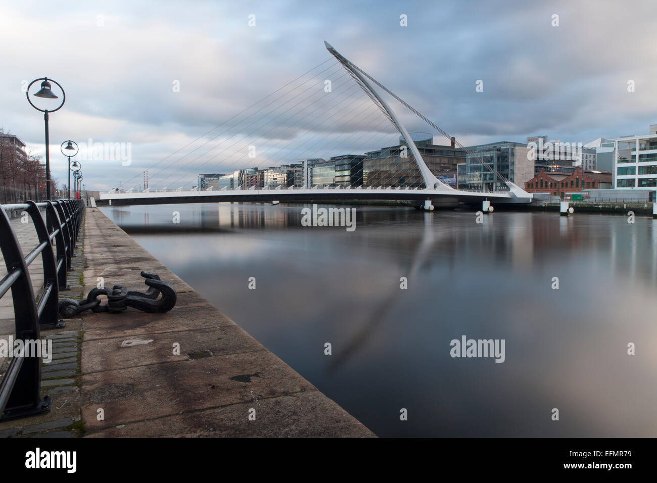 Dublin's River Liffey with Samuel Beckett Bridge reflected.in the calm ...