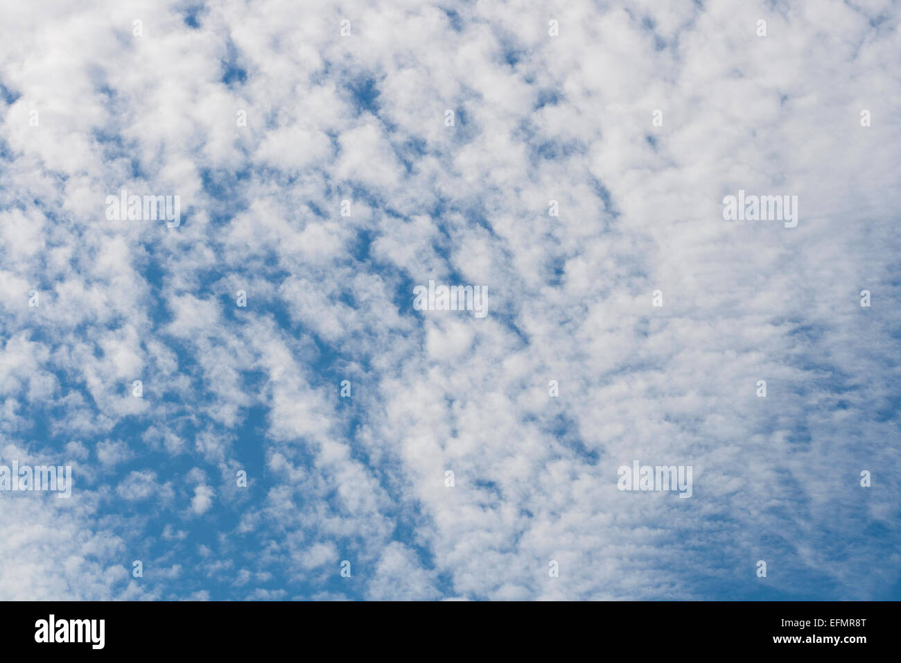 blue sky and fluffy clouds background Stock Photo - Alamy