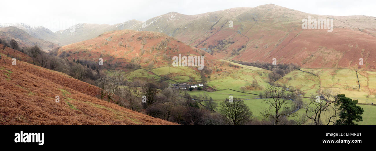 A mid-winter  panoramic view of Troutbeck and some of the Lake District's snow-spattered fells from High Kingate Stock Photo