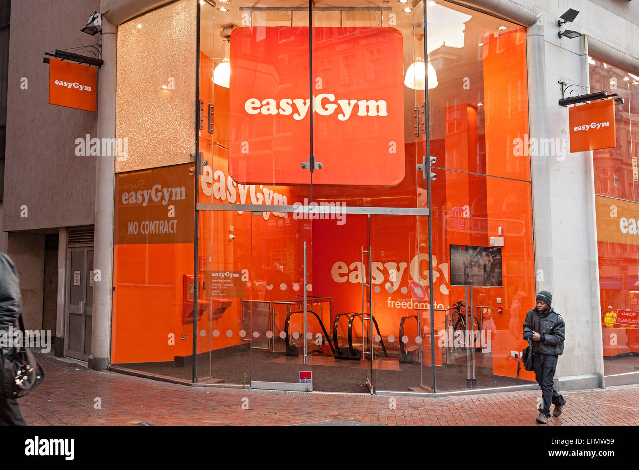 Easy gym birmingham central with orange coloured entrance Stock Photo
