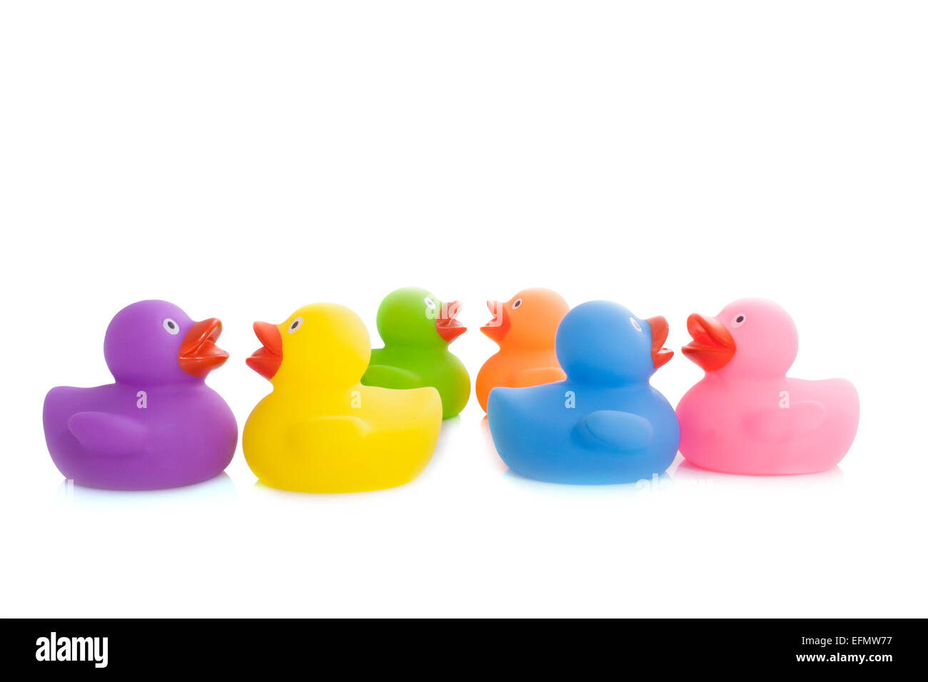 Six colorful rubber ducks isolated on white Stock Photo
