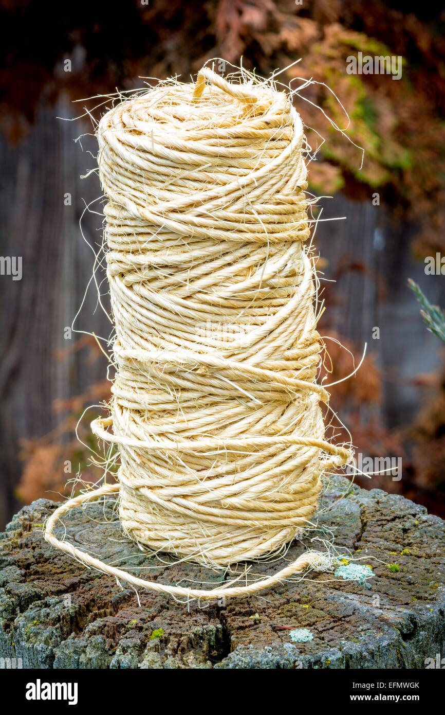 Roll of twine on a fence post Stock Photo