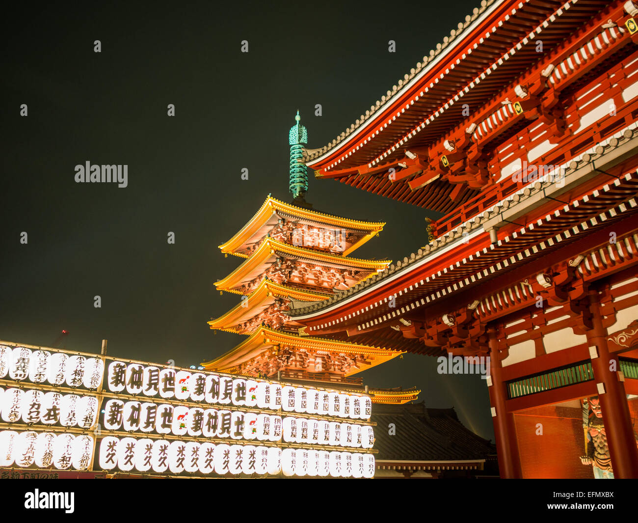 Senso-ji temple and pagoda at night by the white lanterns Stock Photo