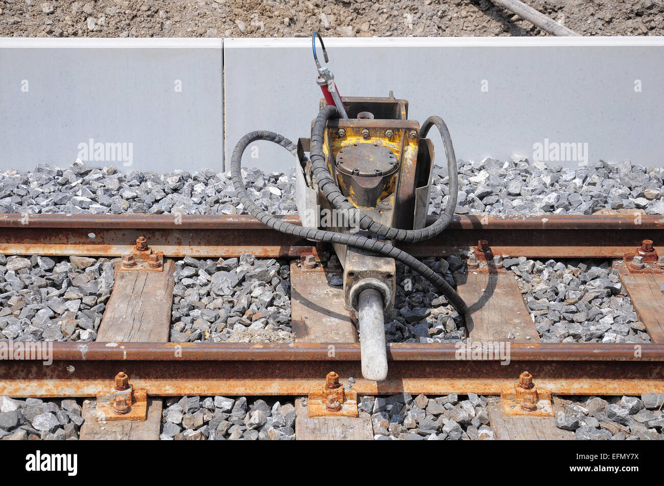 Jackhammer on the railway track by the platform. Stock Photo