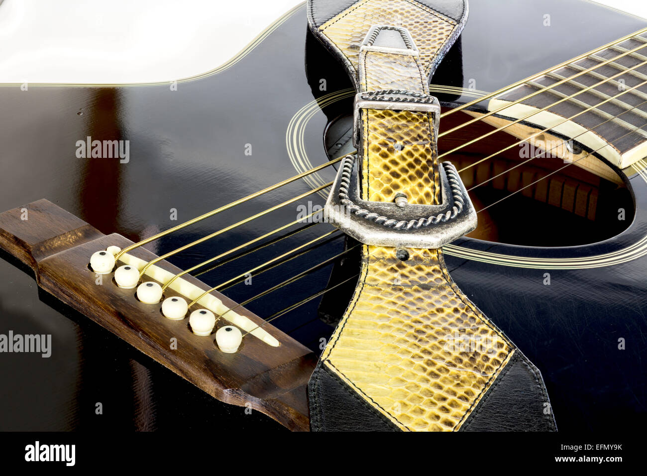 Guitar with strap and sound hole Stock Photo Alamy