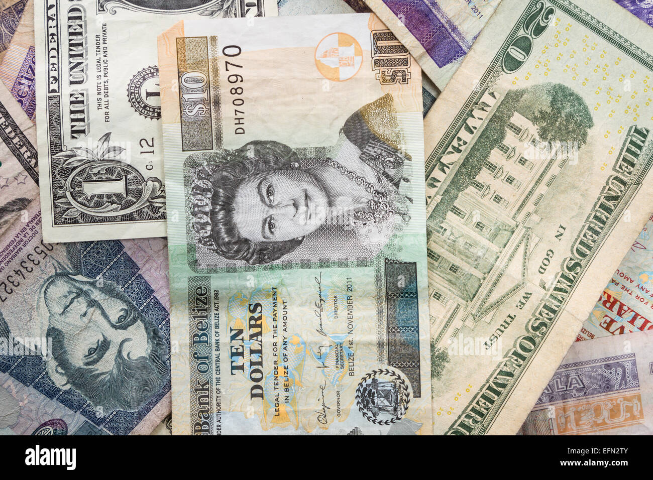 close up of cash bills from different countries around the world Stock