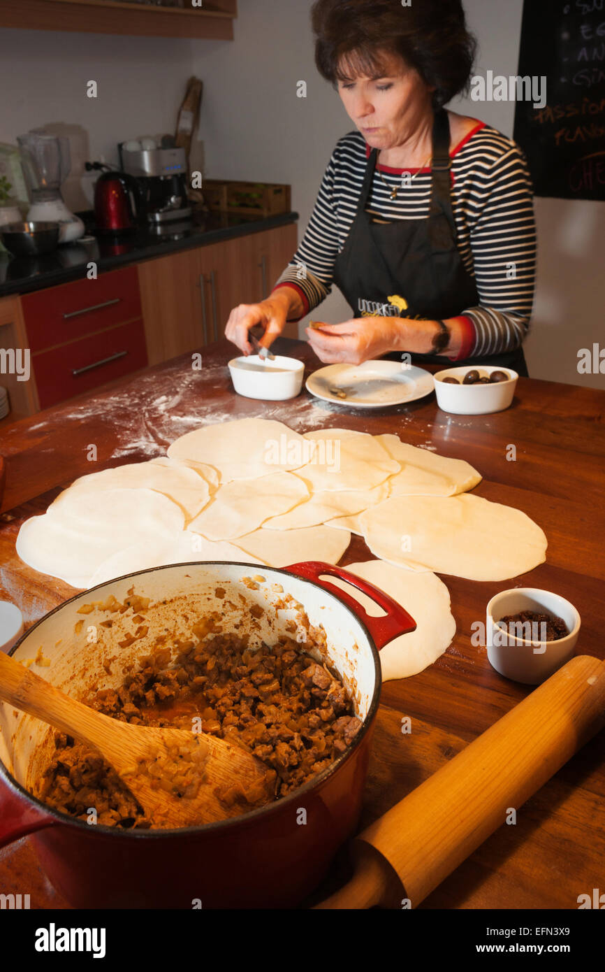 Woman preparing Empanadas de Pino, cooking class, Bellavista district, Santiago, Chile, South America Stock Photo