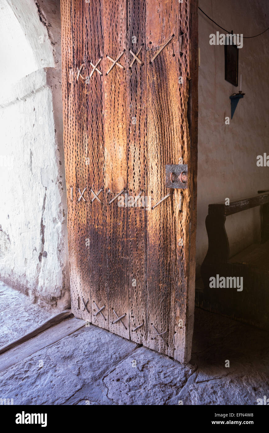 Entrance door made of cactus wood and leather bindings at the oldest church in Chile, Chiu-Chiu village, Atacama desert, Chile, Stock Photo