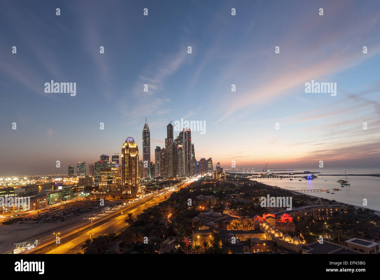 Dubai Marina Towers and Arabian Gulf coast at night. Dubai, United Arab Emirates Stock Photo