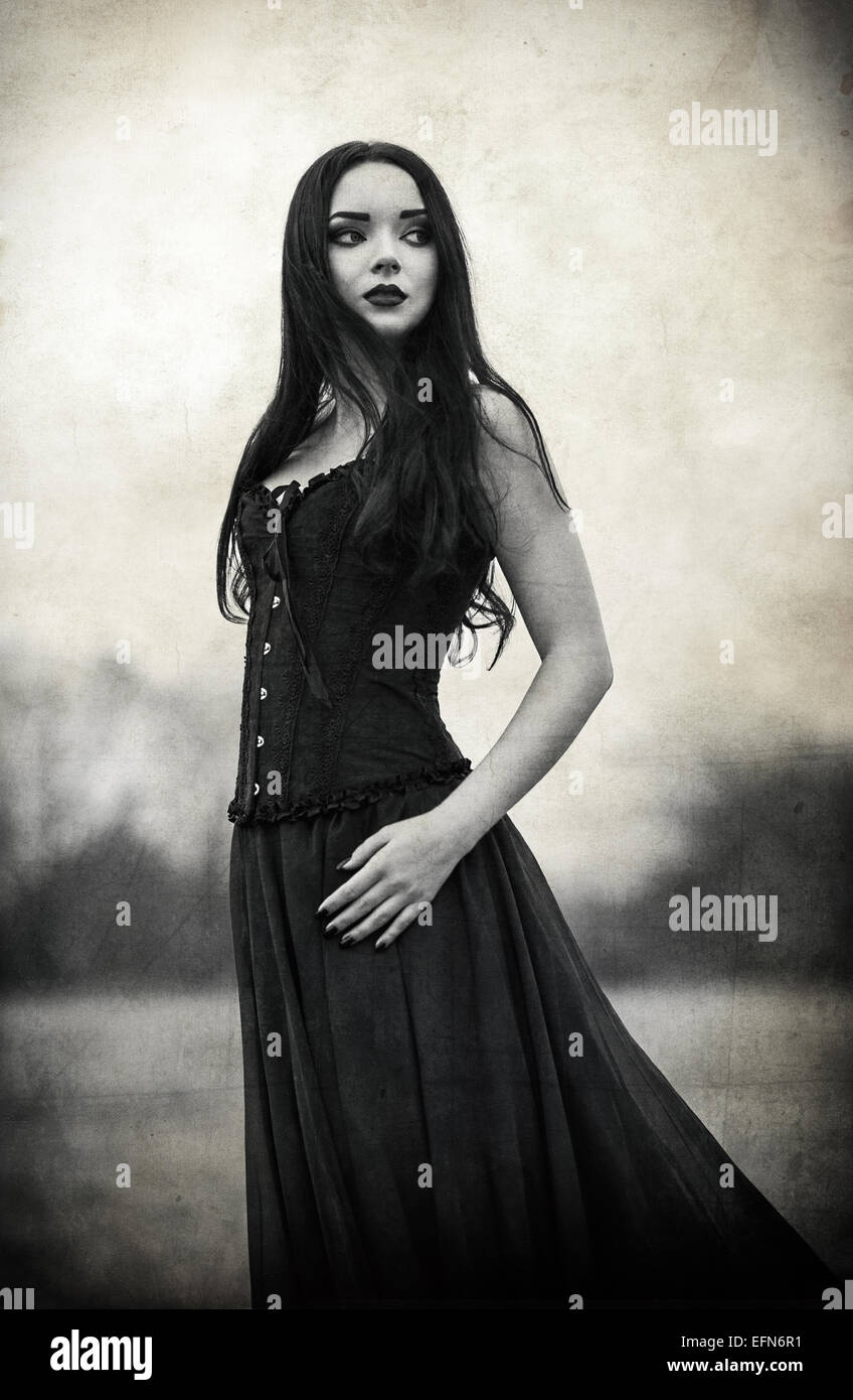 Portrait of a beautiful sad goth girl. Grunge texture effect Stock Photo