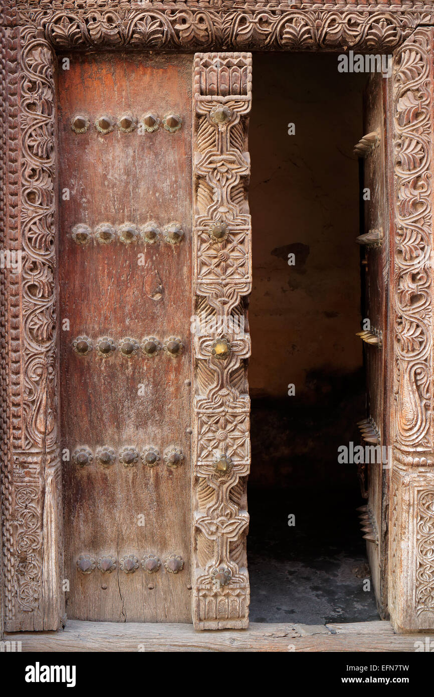 Antique, hand crafted wooden door, Stone Town, Zanzibar Stock Photo