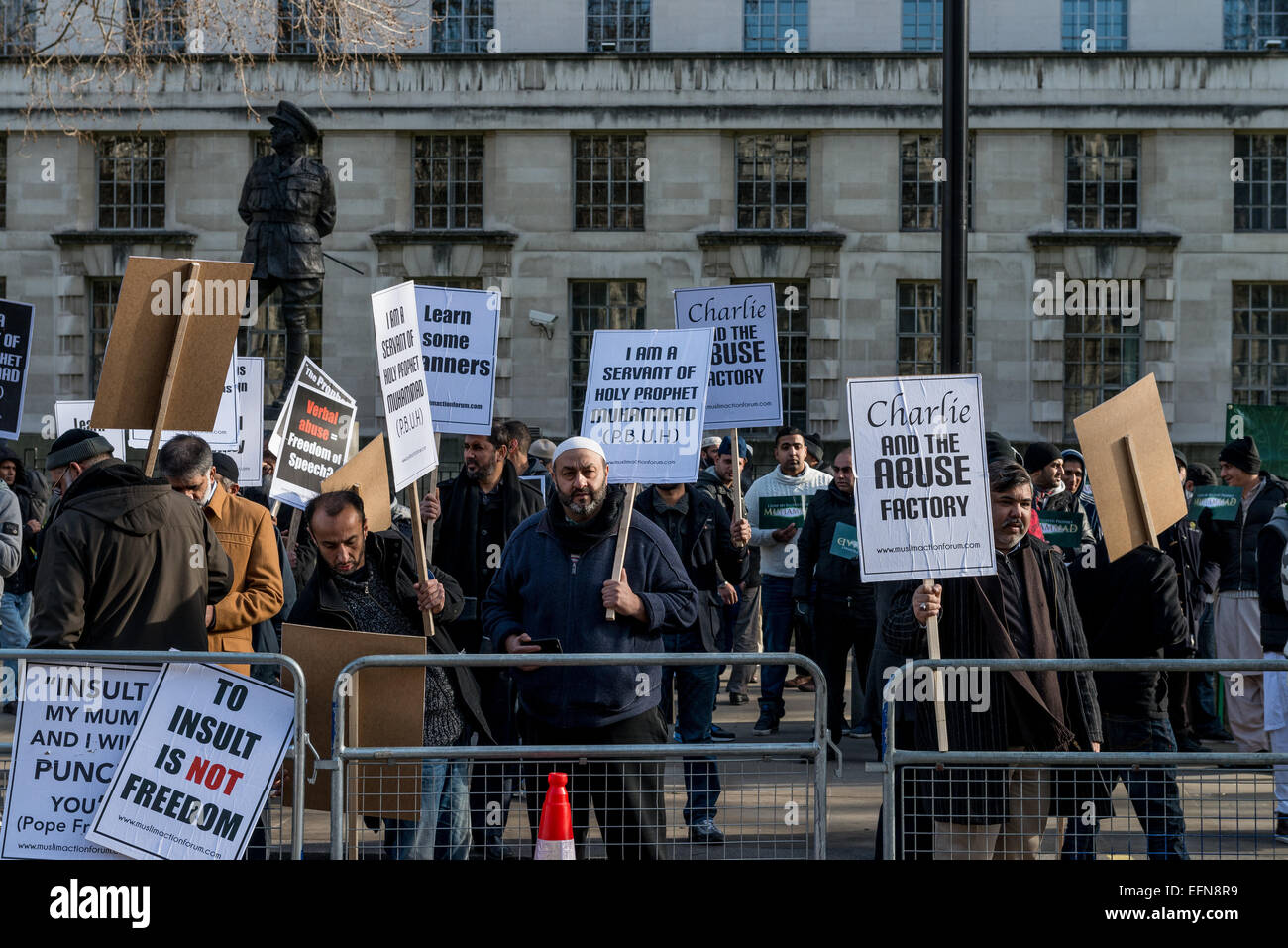 London, UK. 08th Feb, 2015. Hundreds of Muslims from London and another cities in UK came to Downing Street today to protest against reprinting of the cartoon of Holy Prophet Muhammad. Pictures of the Prophet Muhammad are forbidden in Islam due to the central tenet that Muhammad was a man, not a god, and that portraying him could lead to revering a human in lieu of Allah. Credit:  ZUMA Press, Inc./Alamy Live News Stock Photo