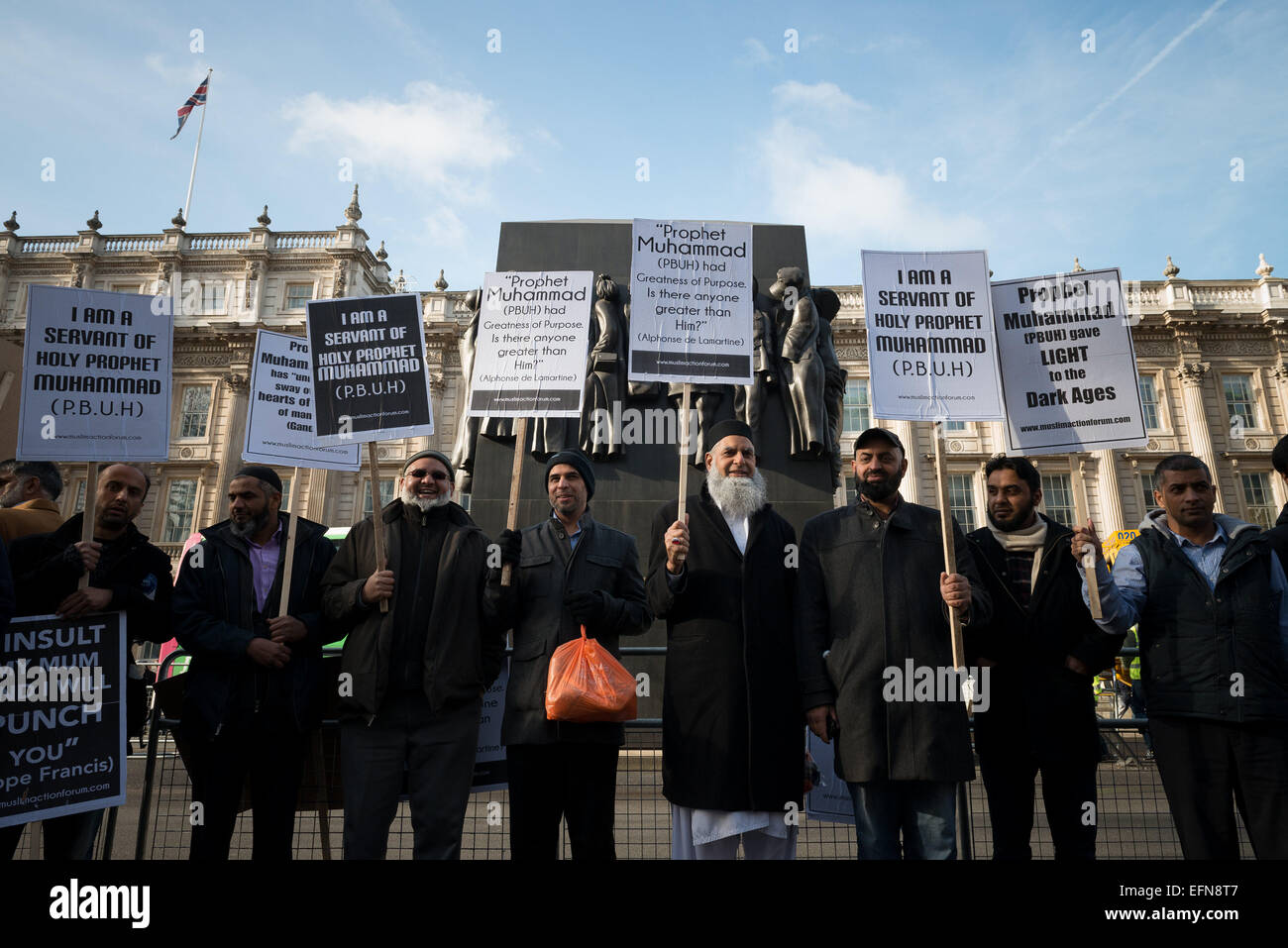 London, UK. 08th Feb, 2015. Hundreds of Muslims from London and another cities in UK came to Downing Street today to protest against reprinting of the cartoon of Holy Prophet Muhammad. Pictures of the Prophet Muhammad are forbidden in Islam due to the central tenet that Muhammad was a man, not a god, and that portraying him could lead to revering a human in lieu of Allah. Credit:  ZUMA Press, Inc./Alamy Live News Stock Photo