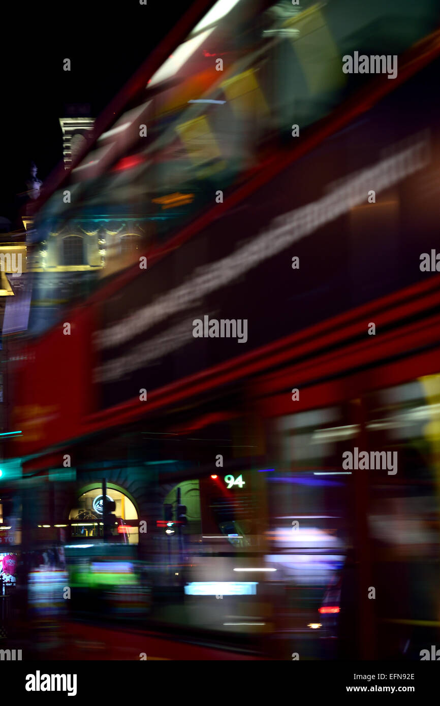 London bus motion blur on Piccadilly Circus at night Stock Photo